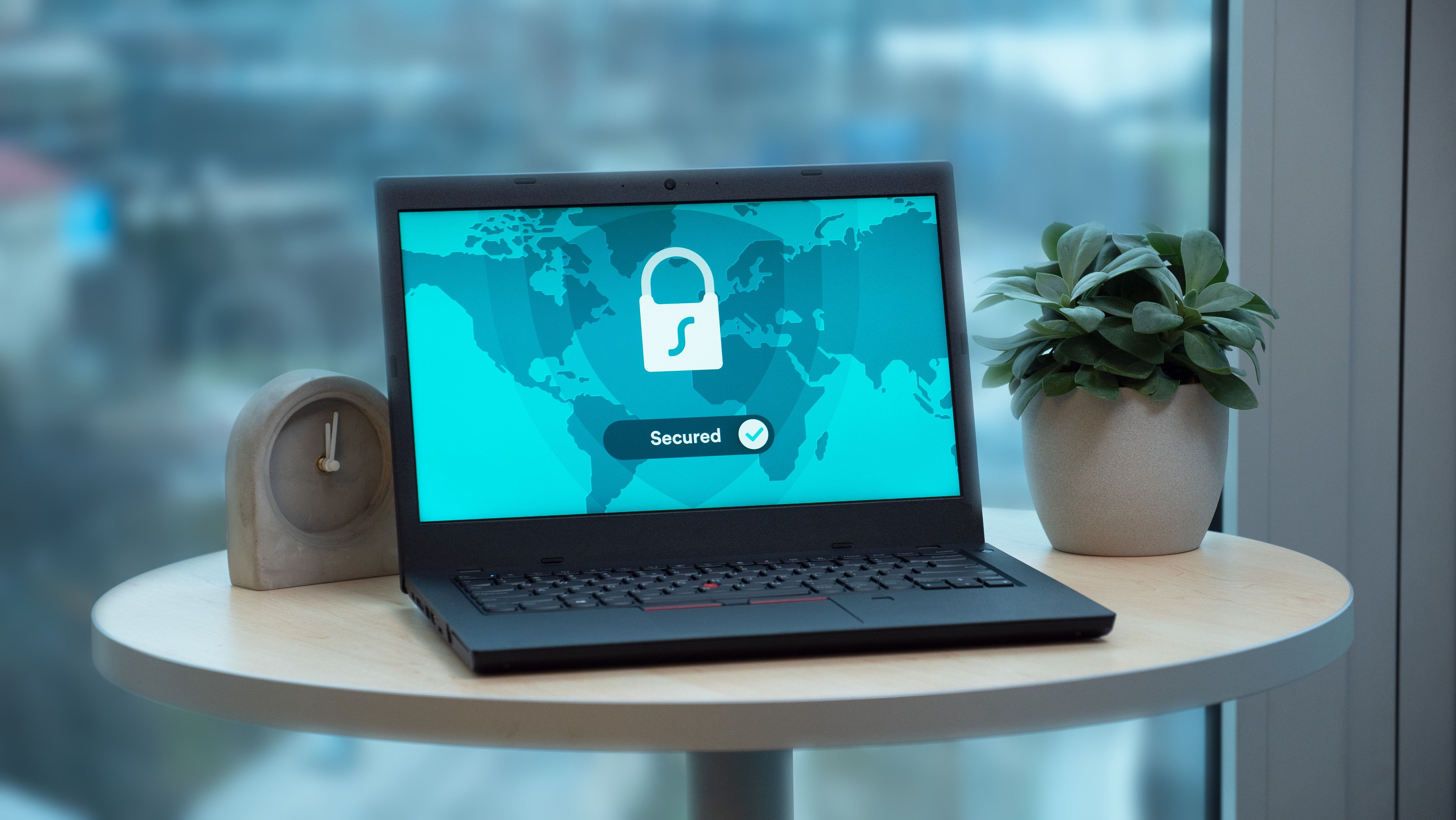 Illustration photo of a laptop showing a security lock icon on a desk