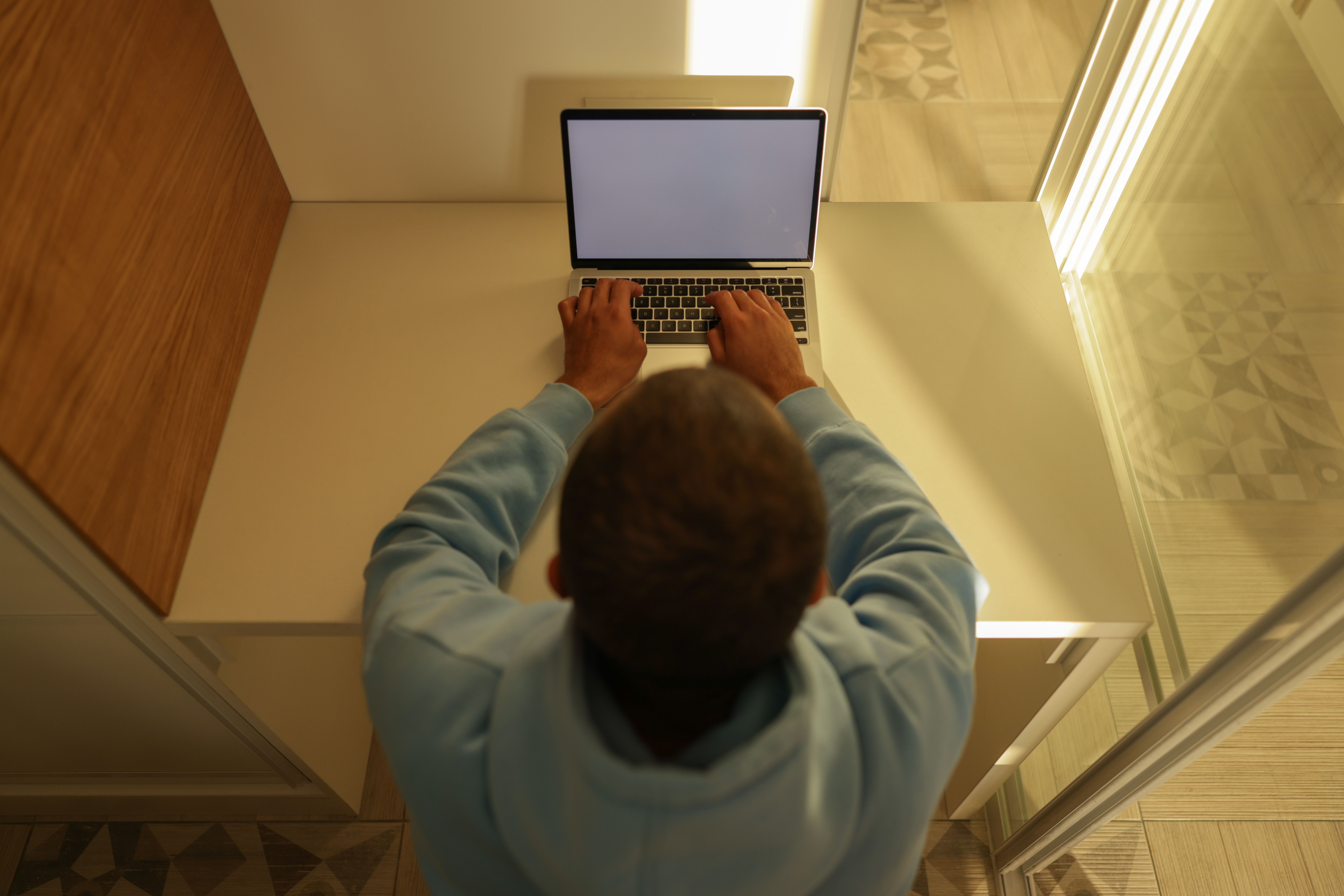 Person using a laptop at a desk