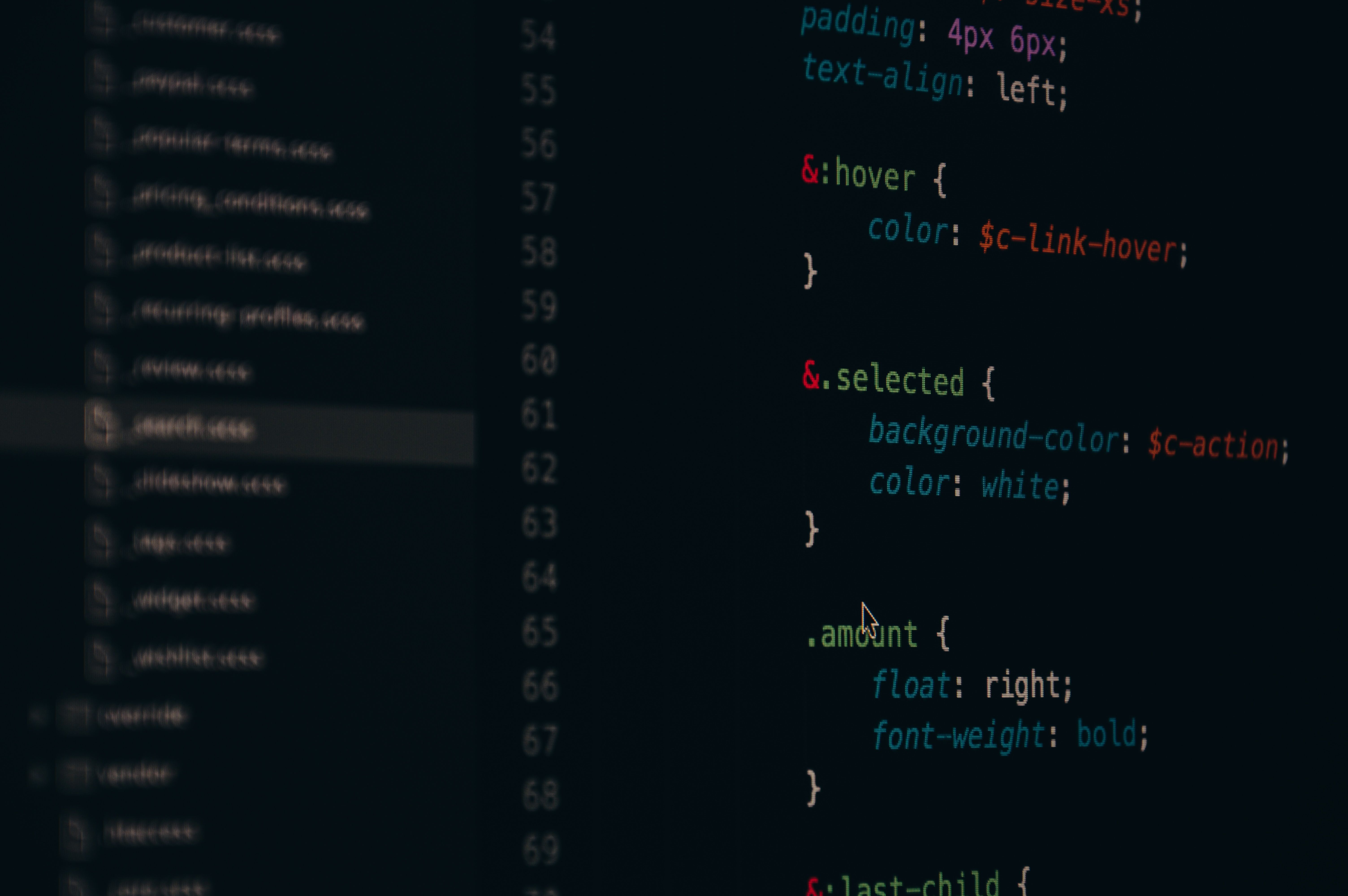 Developer monitor screen displaying lines of CSS and front-end code.