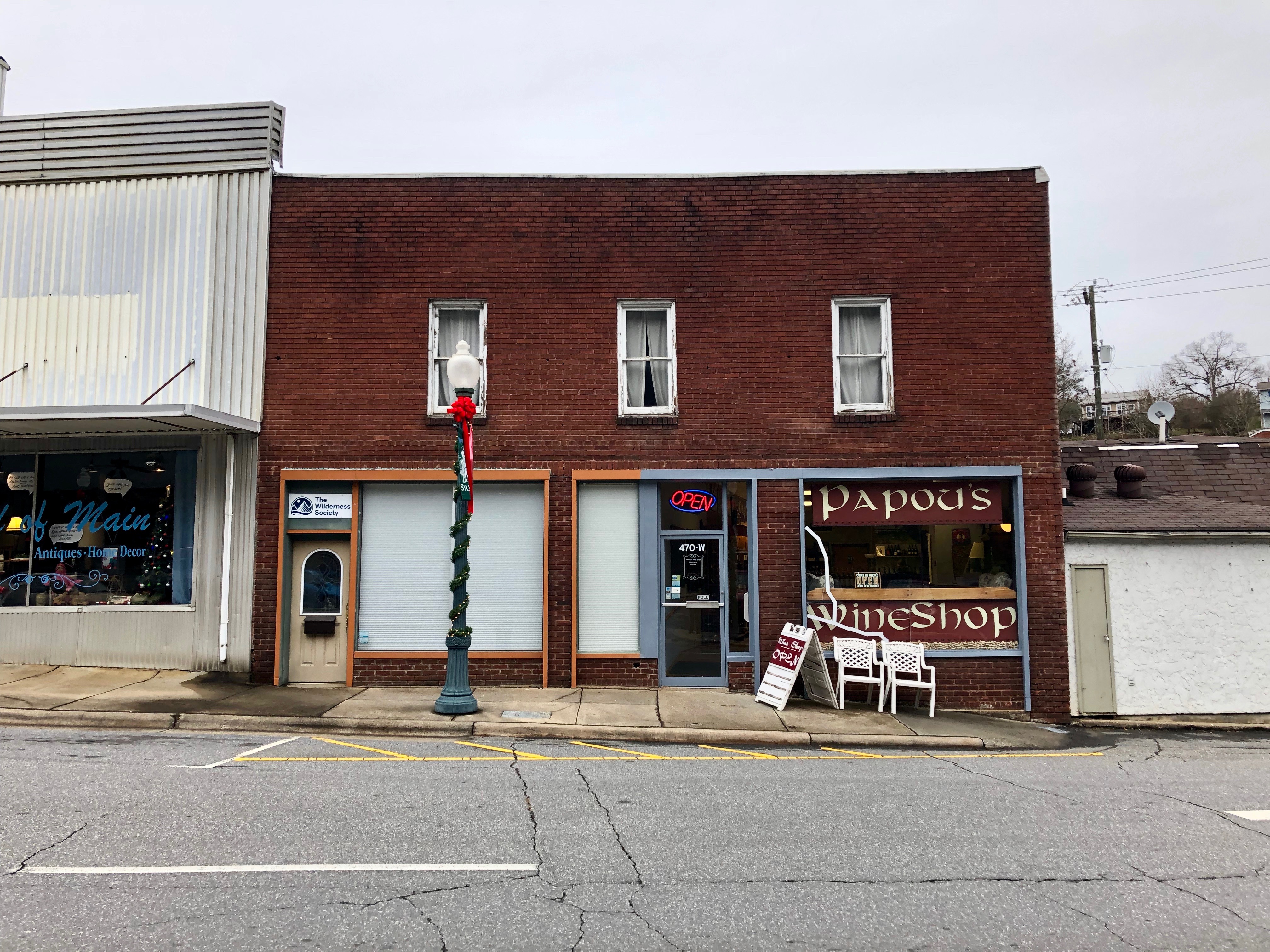 Small local storefront building, representing the small teams who can now access AI agent tooling via the free tier