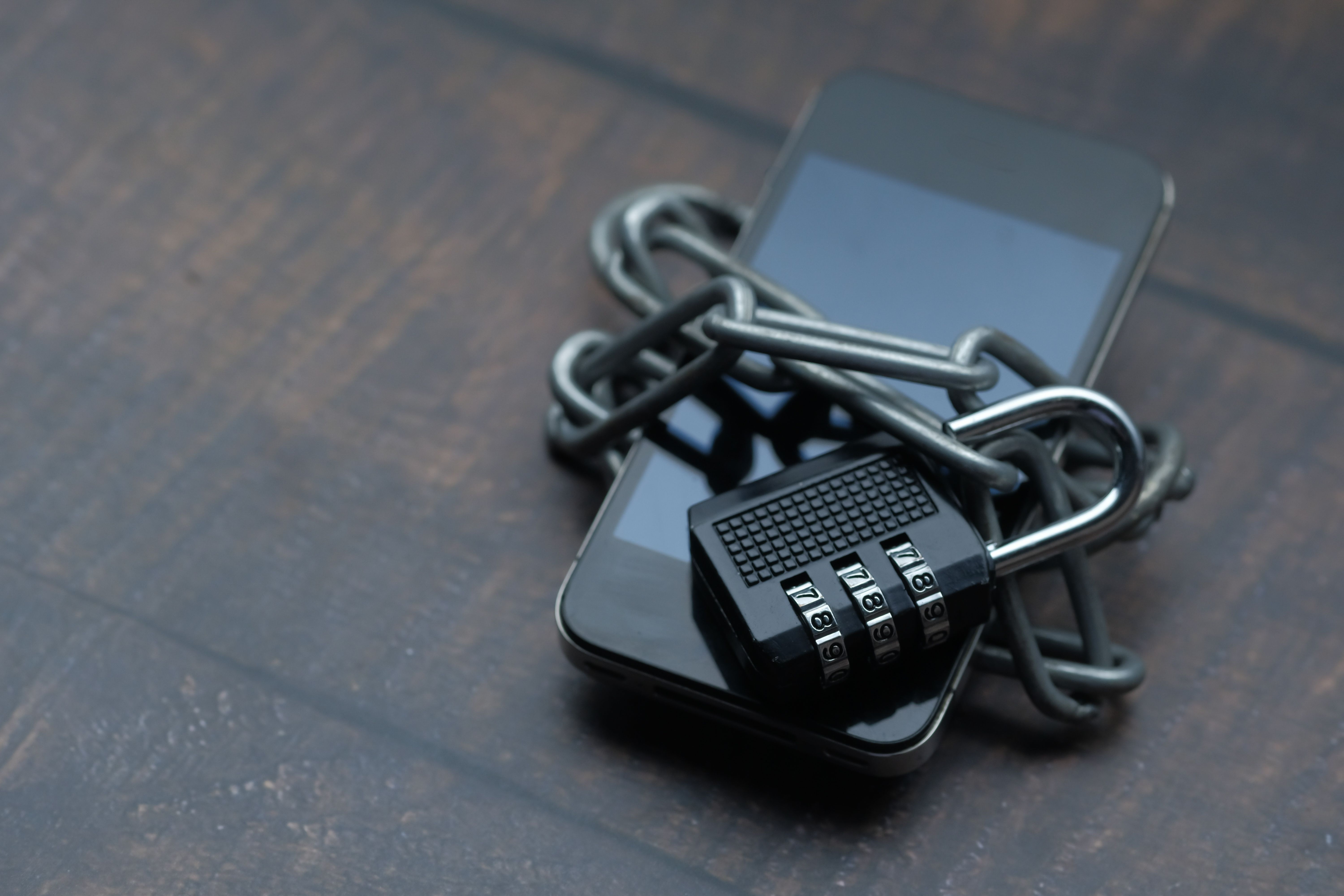 Illustration photo of a padlock securing a smartphone