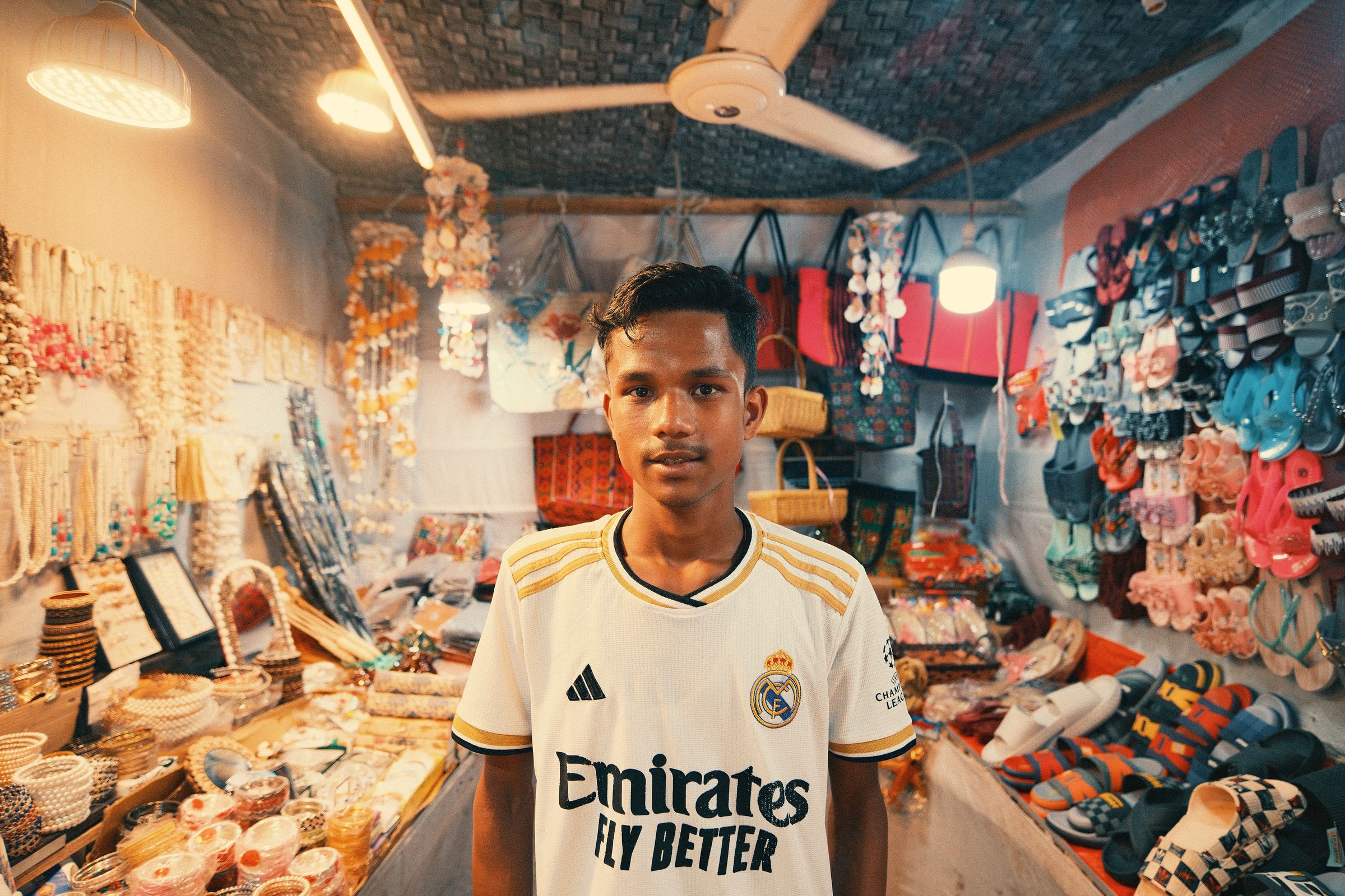 Illustration photo of a young small-business vendor at a colourful market stall