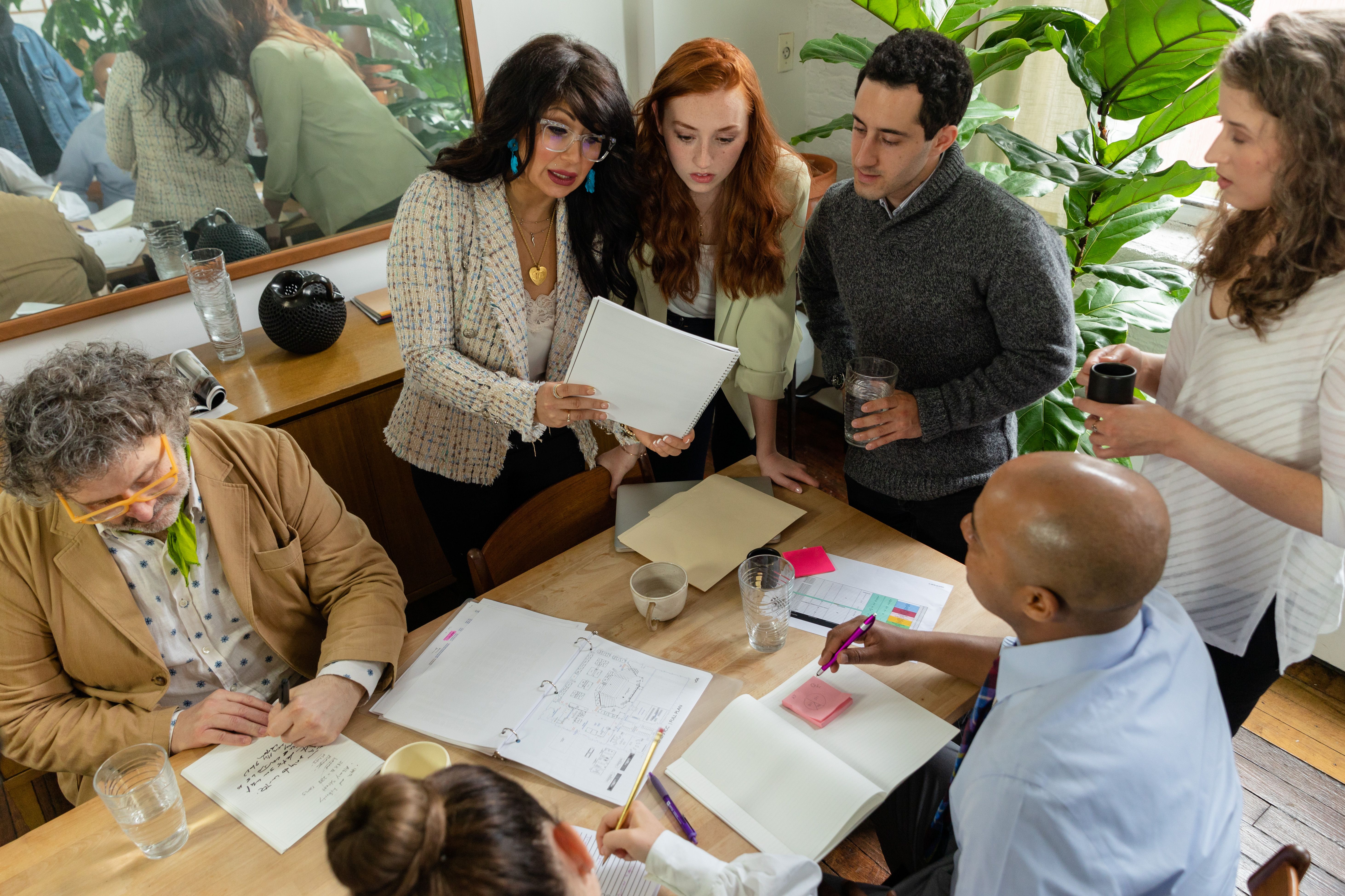 Illustration photo of a team reviewing documents together in an office