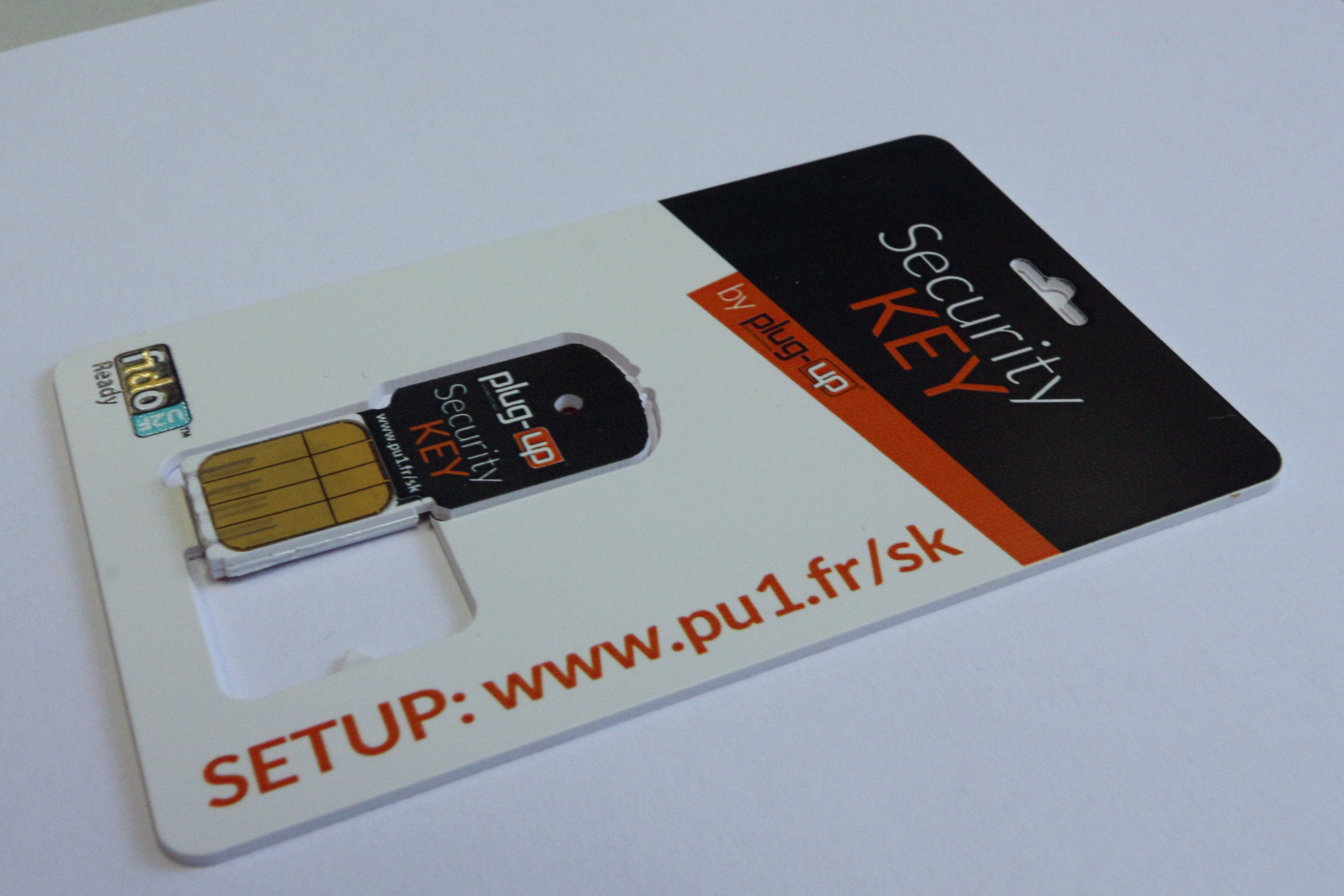 Photograph of a FIDO U2F hardware security key, distinct from a transferable synced passkey