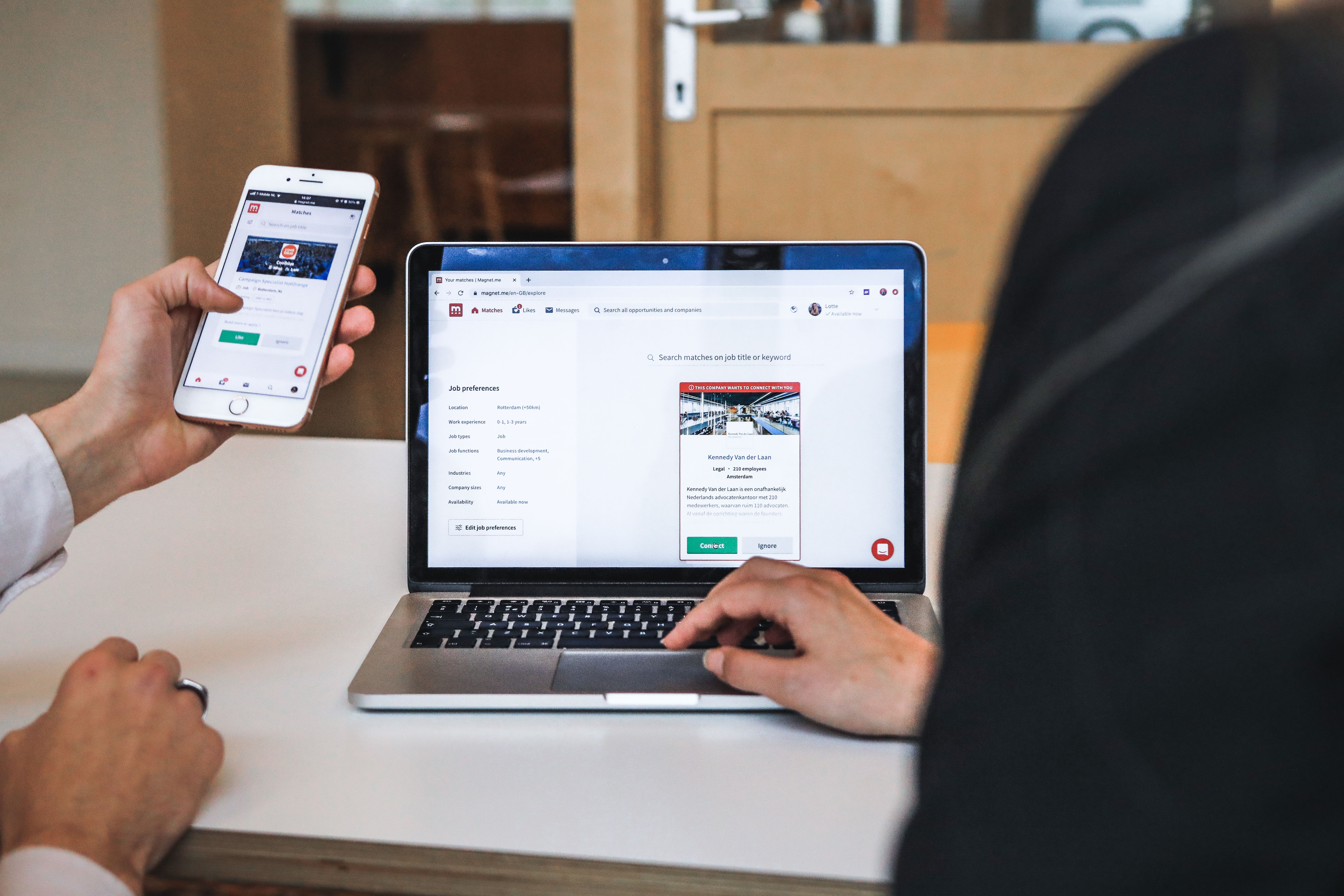 People testing a digital experience with a smartphone and laptop