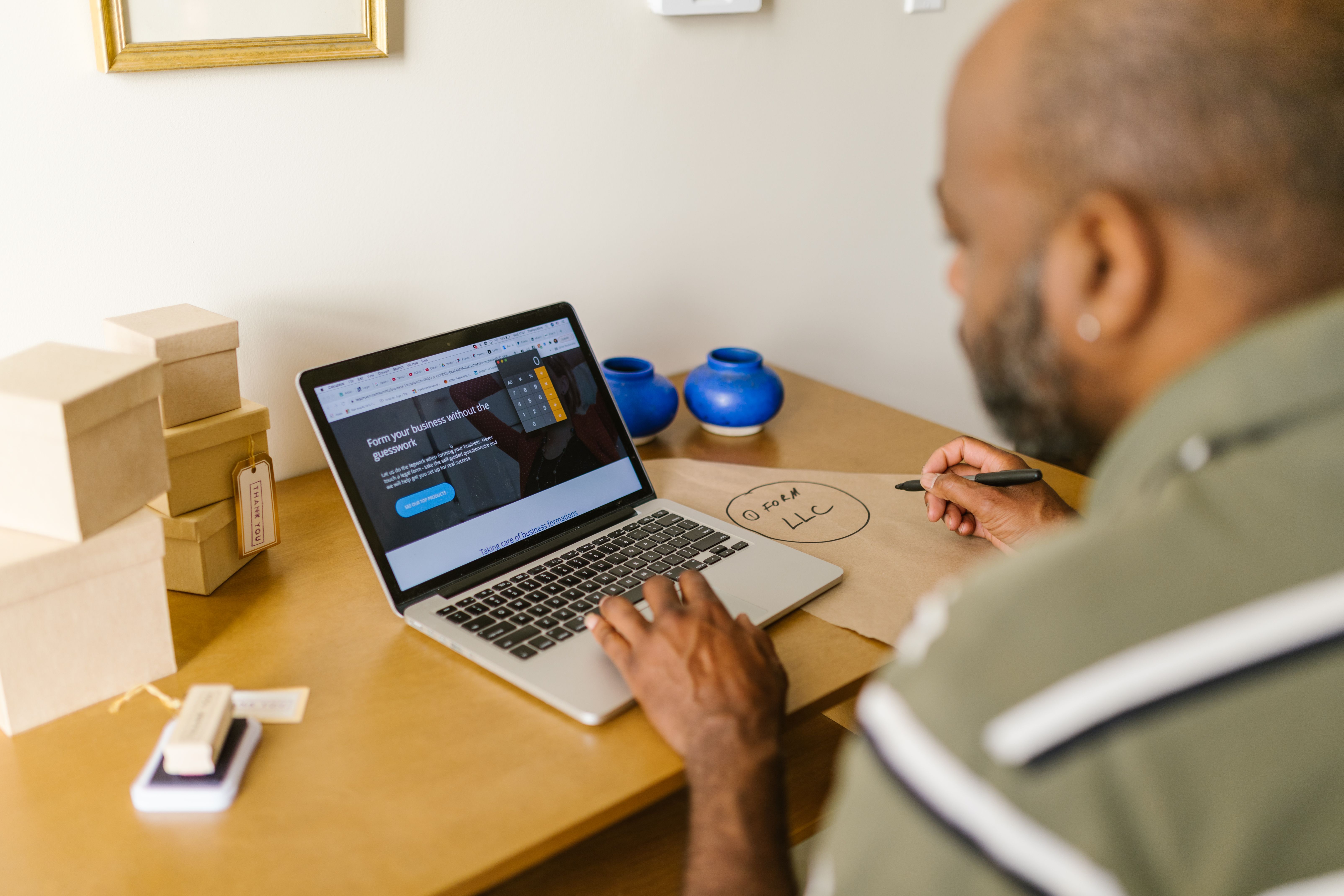 An entrepreneur working at a laptop.