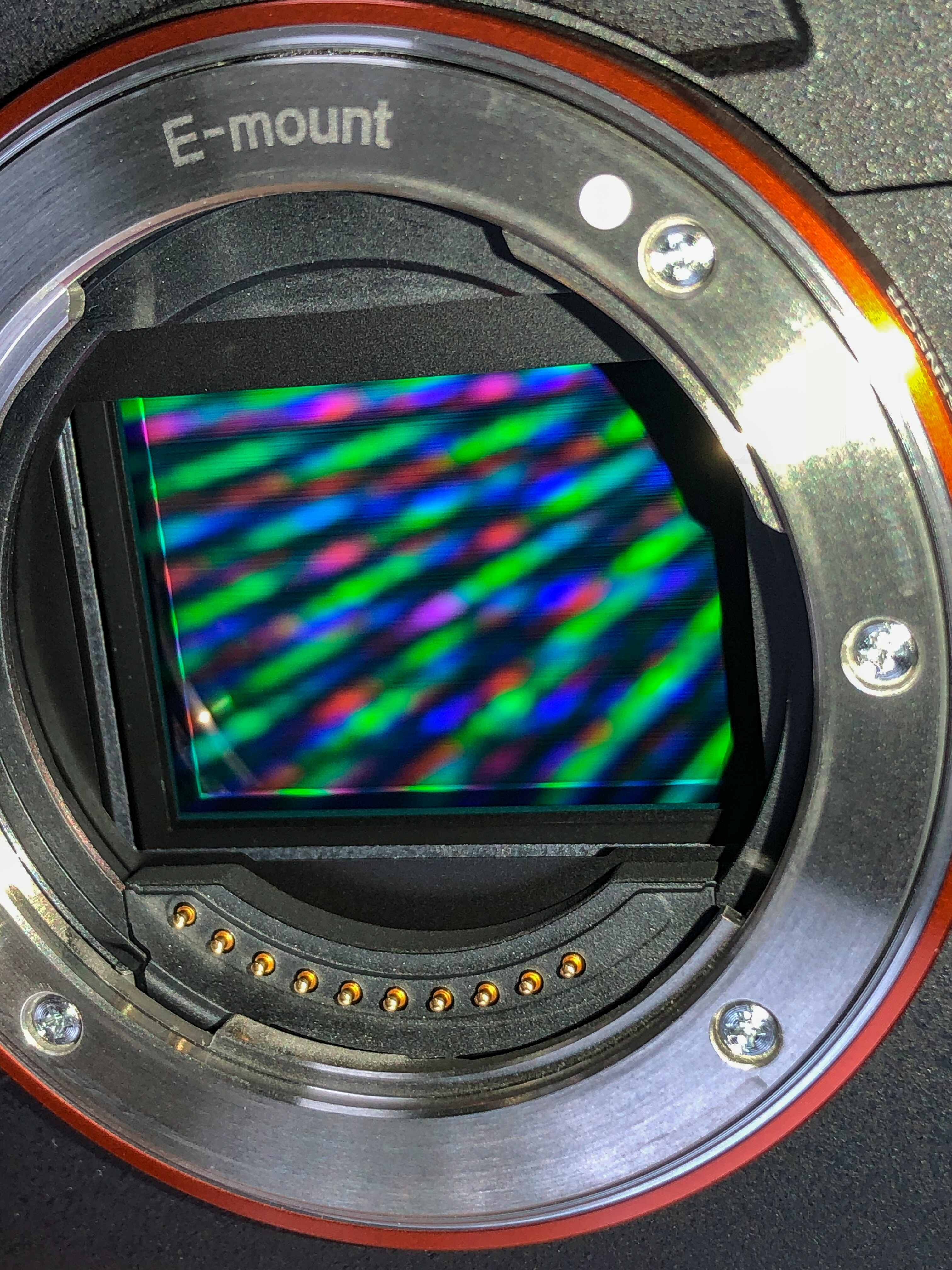 Sony a7R III camera sensor seen through the open lens mount; generic sensor example, not an iPhone.