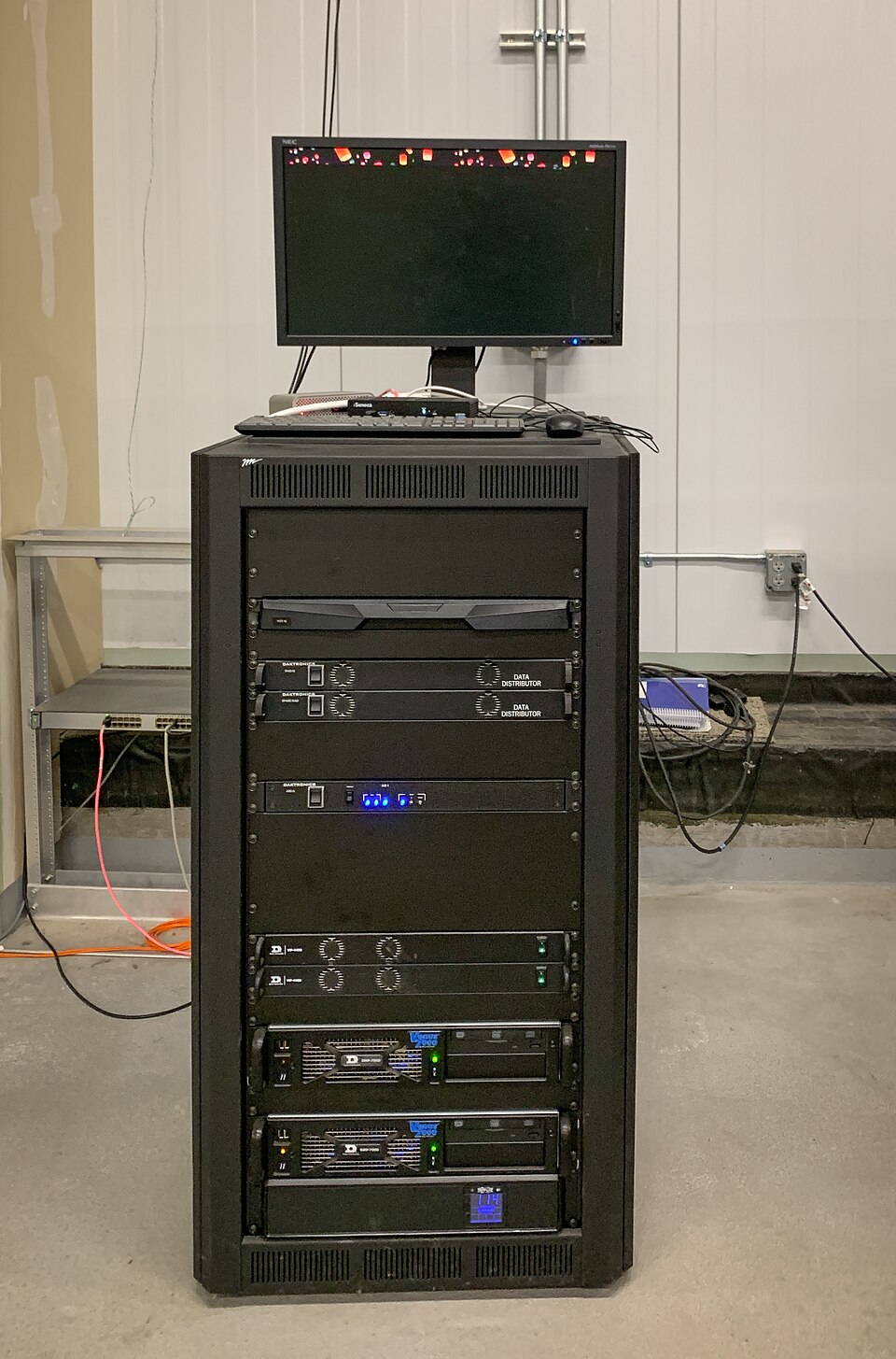 High-density server racks and networking patch panels inside a modern enterprise datacenter.