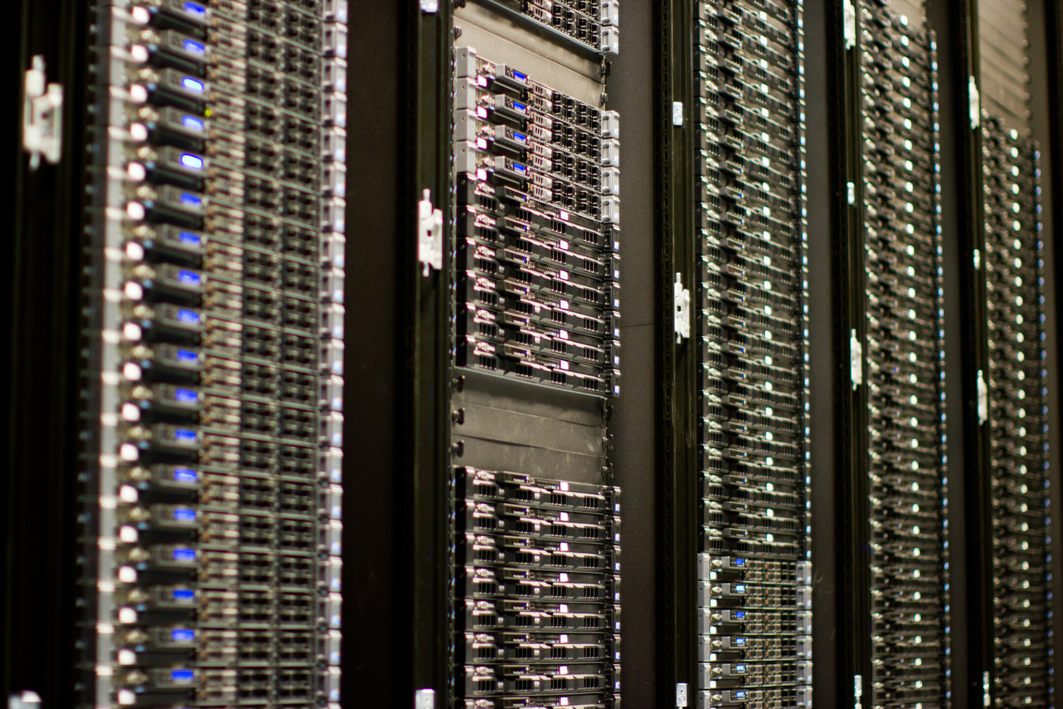 Photograph of server racks inside a global data center facility representing distributed edge computing infrastructure